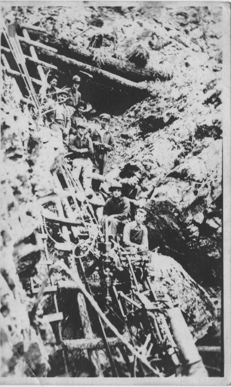 Men working on a hillside. Probably a mine in Montana. George Vautier is third row from top on right side. 1916 or 17