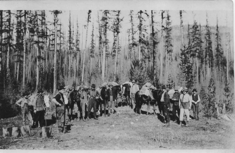 Lumberjacks. Douglas O'rouark and George Vautier are in the foreground on the right side, George Vautier with his hands in his pockets.