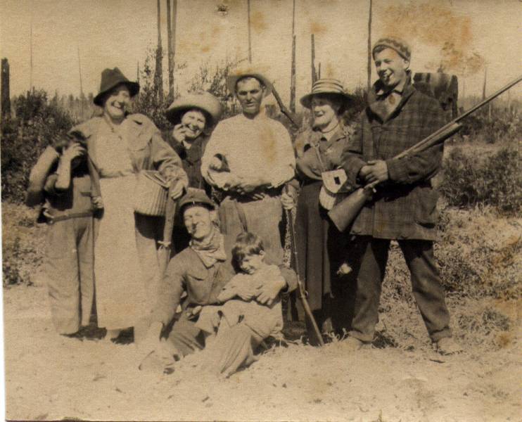 Vautier friends and family. George Vautier Sr. and his wife Ella Vautier are 4th and 5th from the left the two older boys are their sons. George Vautier Jr. is not in the picture. Don't know who the younger boys are. This looks like a fishing/hunting trip on the farm in Sequim.