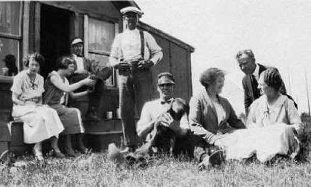 dad's family and friends probably in Sequim. They are identified on the back, L-to-R: Mrs. Wold; Edna (holding Geo. Jr.'s foot); George Jr., George Sr., standing; Joseph, Ella, Mr. Wold, Mrs Johnson.